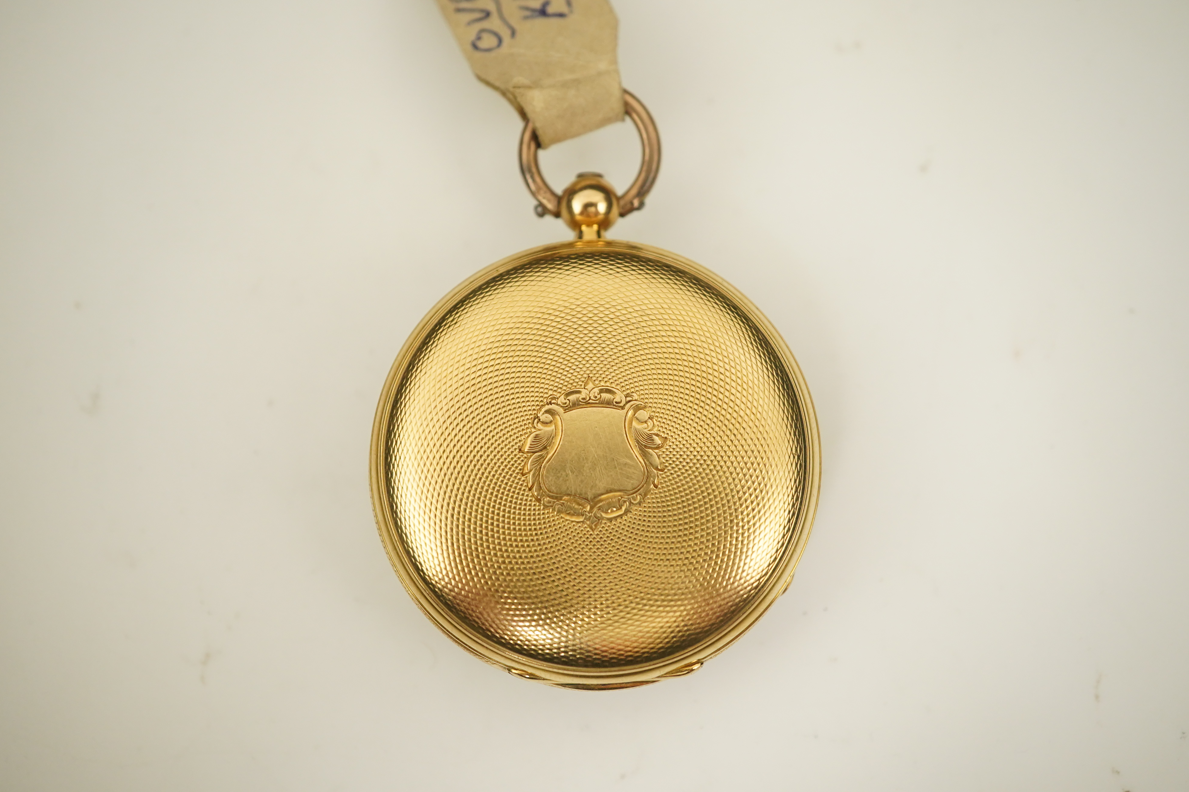 A Victorian engine turned 18ct gold open faced key wind fob watch